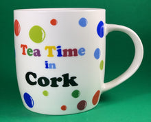 Load image into Gallery viewer, An 11oz bone china  brightly colored polka dot mug that says Teatime in Cork
