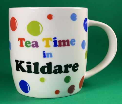 An 11oz bone china  brightly colored polka dot mug that says Teatime in Kildare