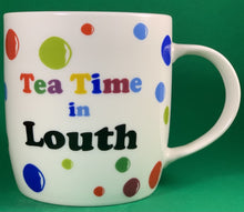 Load image into Gallery viewer, An 11oz bone china  brightly colored polka dot mug that says Teatime in Louth
