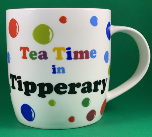 An 11oz bone china  brightly colored polka dot mug that says Teatime in Tipperary