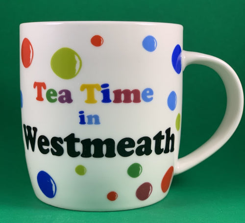 An 11oz bone china  brightly colored polka dot mug that says Teatime in Westmeath