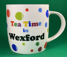 Load image into Gallery viewer, An 11oz bone china  brightly colored polka dot mug that says Teatime in Wexford

