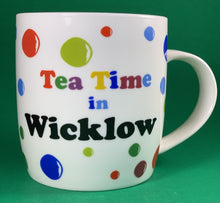 Load image into Gallery viewer, An 11oz bone china  brightly colored polka dot mug that says Teatime in Wicklow
