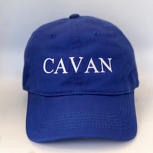 Blue  baseball cap with 'Cavan' embroidered in white thread. Adjustable back strap with metal clasp.