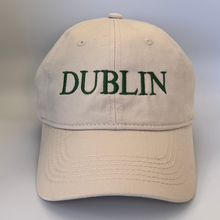 Load image into Gallery viewer, Beige cap with &#39;Dublin&#39; embroidered in green on a beige background
