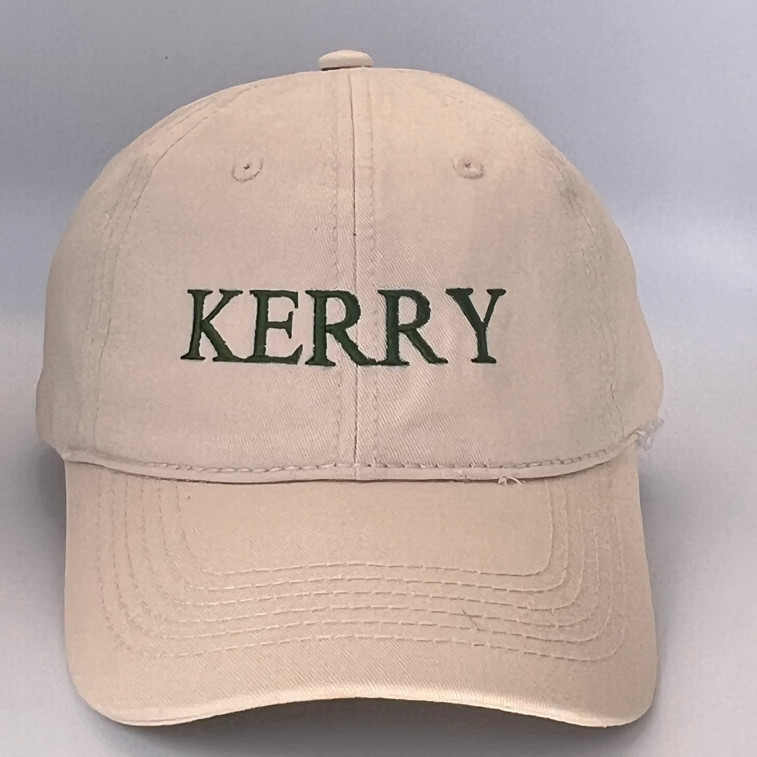 Beige cap with 'KERRY' embroidered in green on a a beige background