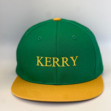 Load image into Gallery viewer, Green trucker style baseball cap with yellow trim.  &#39;Meath &#39; embroidered in yellow thread. Adjustable snap back .
