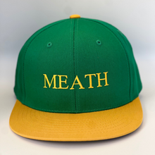 Load image into Gallery viewer, Green trucker style baseball cap with yellow trim.  &#39;Meath &#39; embroidered in yellow thread. Adjustable snap back .
