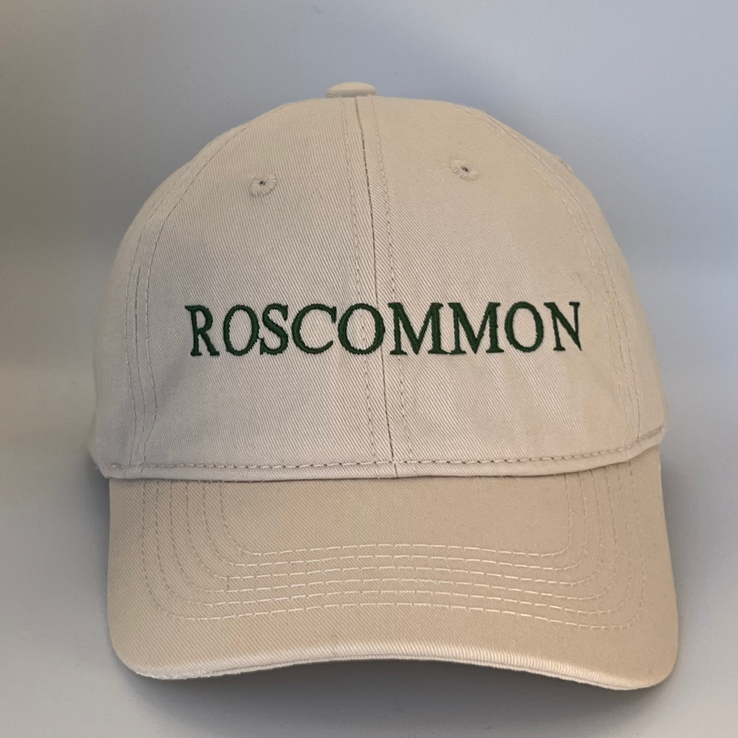 Beige cap with 'ROSCOMMON' text embroidered in green on a beige background