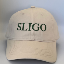 Load image into Gallery viewer, Beige cap with &#39;SLIGO&#39; embroidered in green on a beige background
