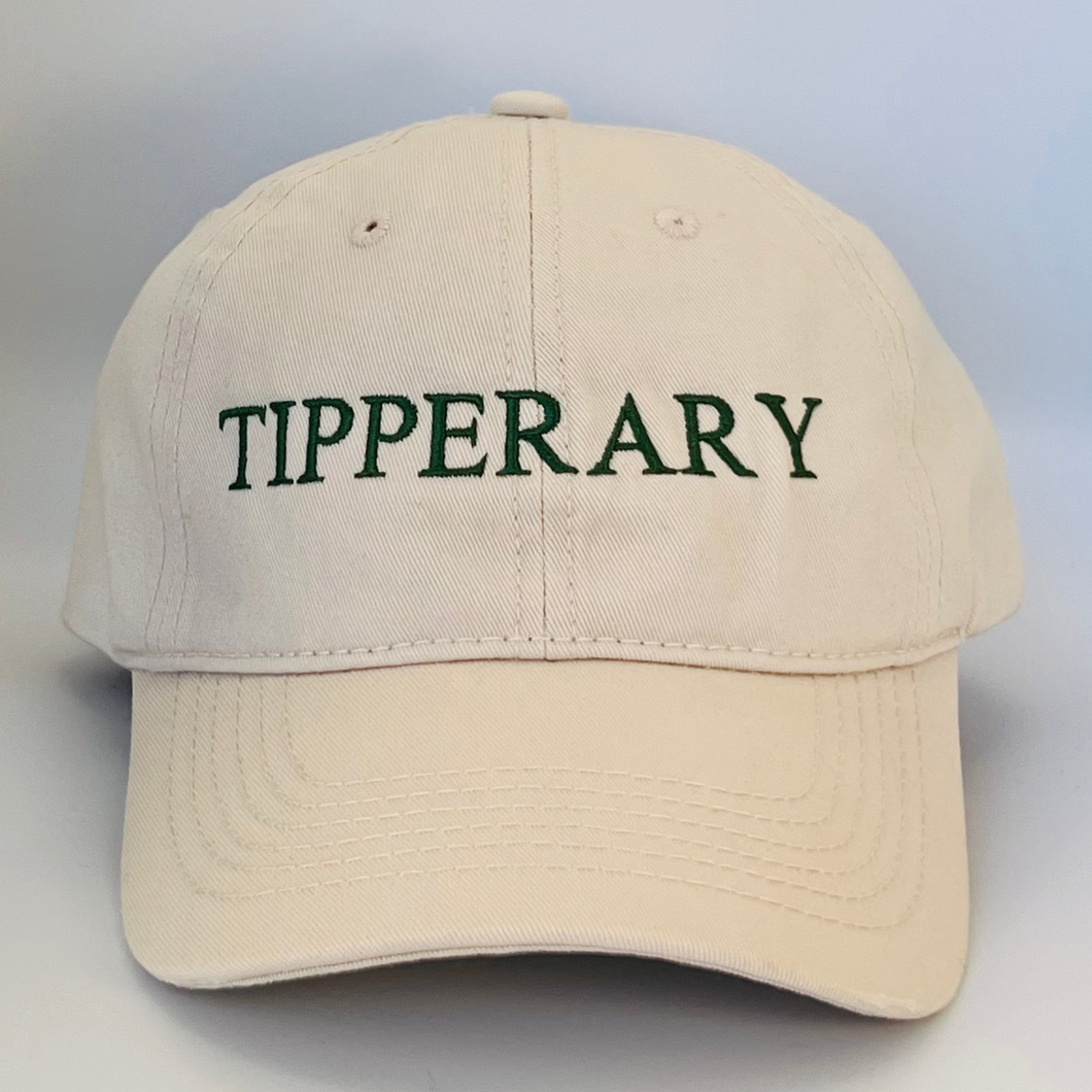 Beige cap with 'Tipperary' text  embroidered in green on a beige background