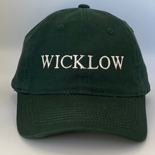Load image into Gallery viewer, Green cap with &#39;WICKLOW&#39; embroidered in white on a green  background
