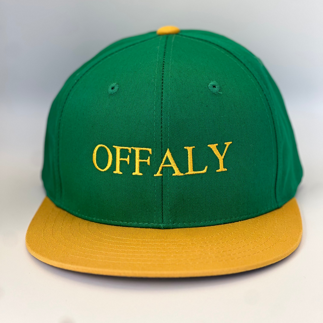 Green and yellow trucker style baseball cap with 'OFFALY' embroidered in yellow thread on a green background