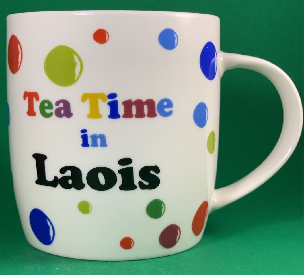 An 11oz bone china  brightly colored polka dot mug that says Teatime in Laois