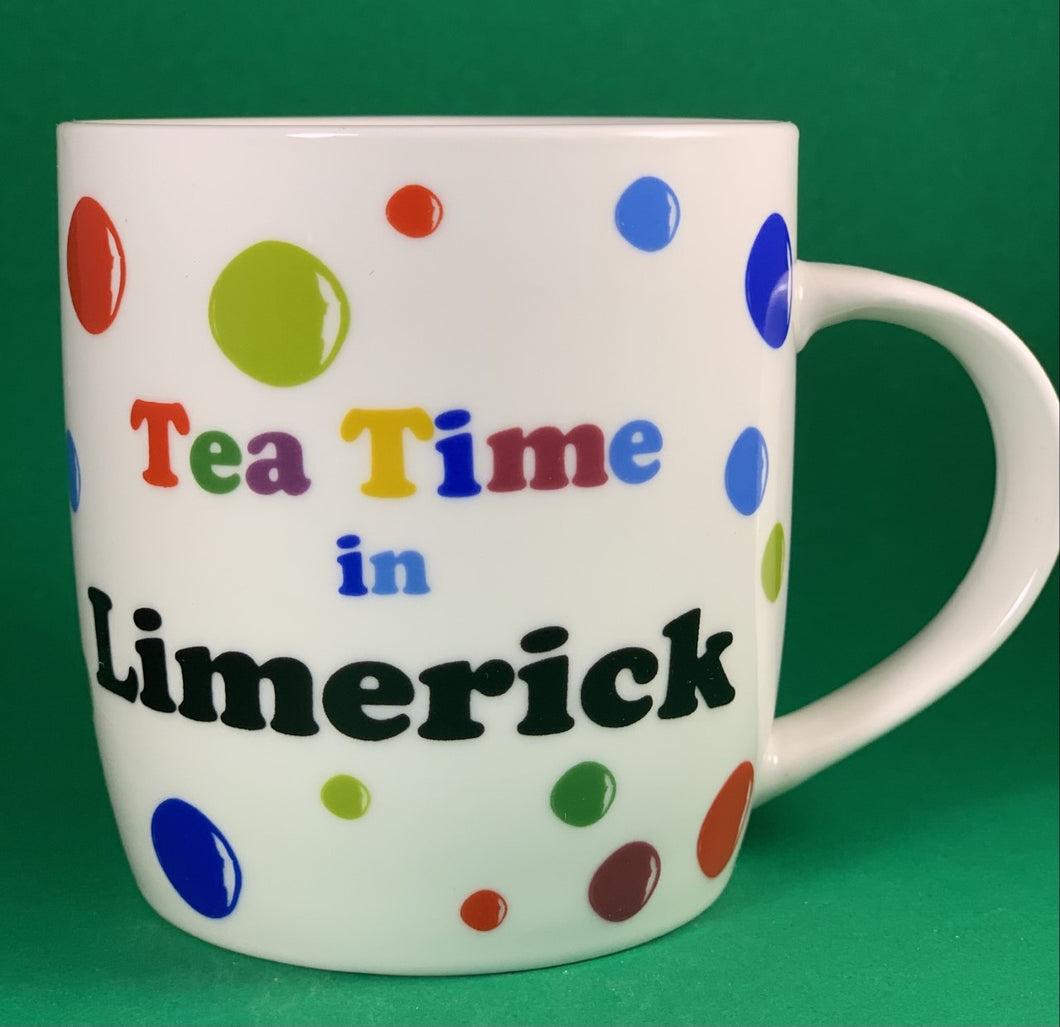 An 11oz bone china  brightly colored polka dot mug that says Teatime in Limerick