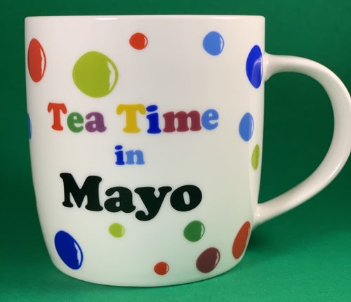An 11oz bone china  brightly colored polka dot mug that says Teatime in Mayo