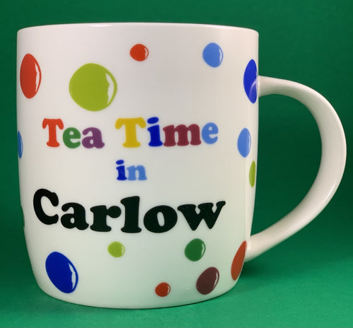 An 11oz bone china  brightly colored polka dot mug that says Teatime in Carlow