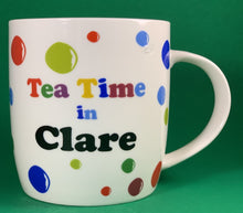 Load image into Gallery viewer, An 11oz bone china  brightly colored polka dot mug that says Teatime in Clare
