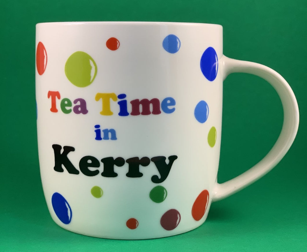 An 11oz bone china  brightly colored polka dot mug that says Teatime in Kerry