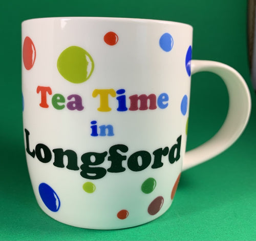 An 11oz bone china  brightly colored polka dot mug that says Teatime in Longford