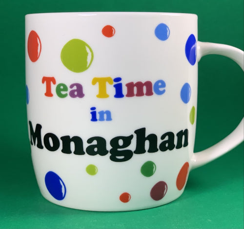 An 11oz bone china  brightly colored polka dot mug that says Teatime in Monaghan