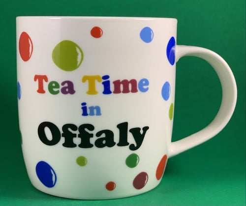 An 11oz bone china  brightly colored polka dot mug that says Teatime in Offaly
